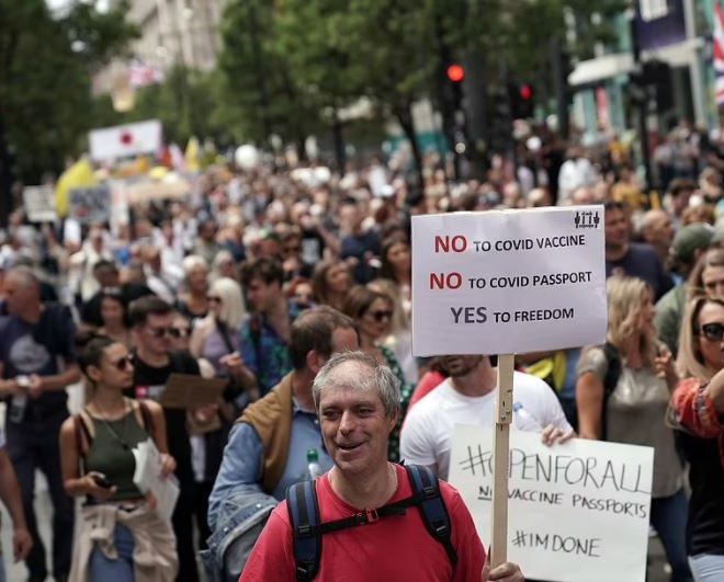 Tens of thousands of anti-lockdown protesters march on London in biggest demo yet.